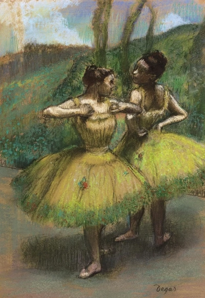 Dos bailarinas en vestidos amarillos.