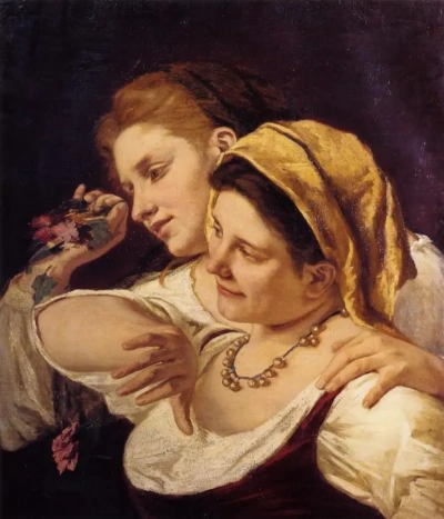 Dos mujeres arrojando flores durante el carnaval.