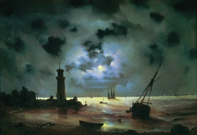 La costa marítima en la noche. En el faro.