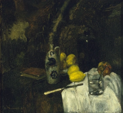 Limones y una botella de la ginebra holandesa